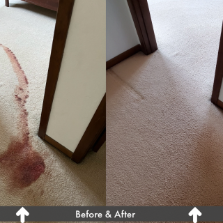 carpet with red stain on the left, cleaned carpet on the right.